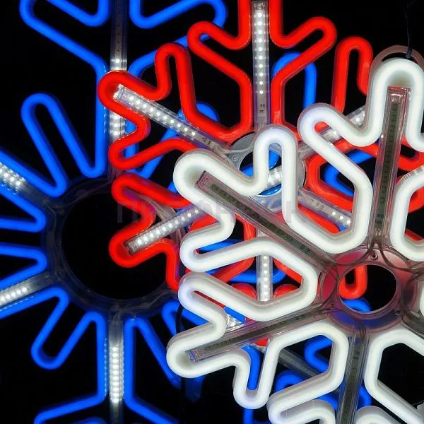Крупный план светодиодной снежинки: белые LED-диоды, провода и крепления, динамическая подсветка