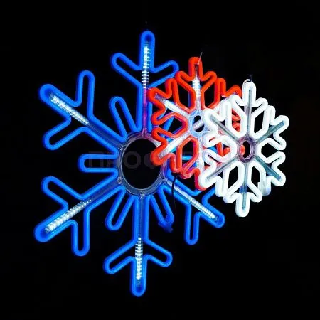 Крупный план светодиодной снежинки: белые LED-диоды, провода и крепления, динамическая подсветка