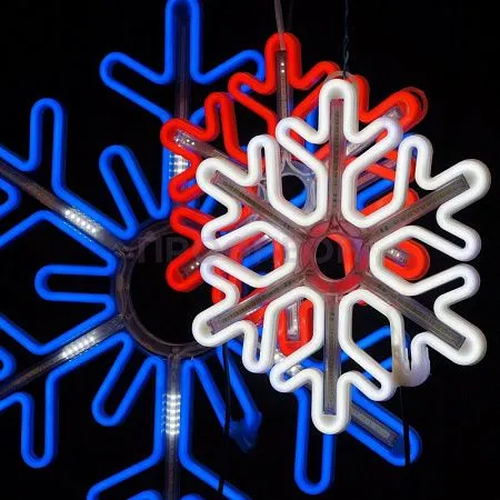 Крупный план светодиодной снежинки: белые LED-диоды, провода и крепления, динамическая подсветка