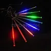 Гирлянда Тающие сосульки RGB на темном фоне, демонстрирующая 10 светящихся нитей по 50 см.