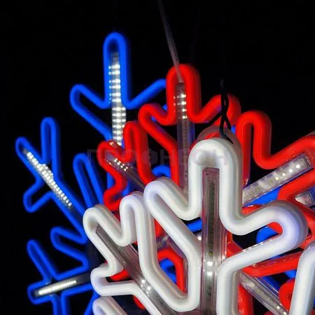 Крупный план светодиодной снежинки: белые LED-диоды, провода и крепления, динамическая подсветка